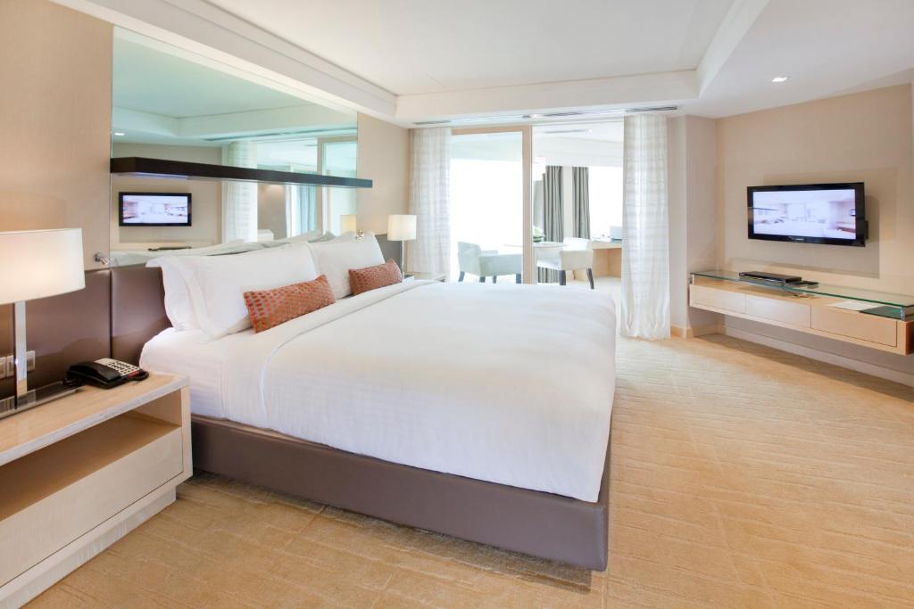 Hotel room showing prayer mat and Qibla direction indicator